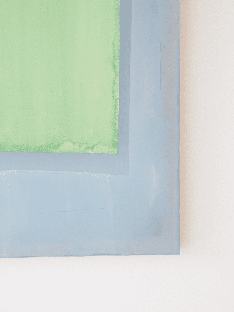 Composition of lemon green coloured paper on indigo blue